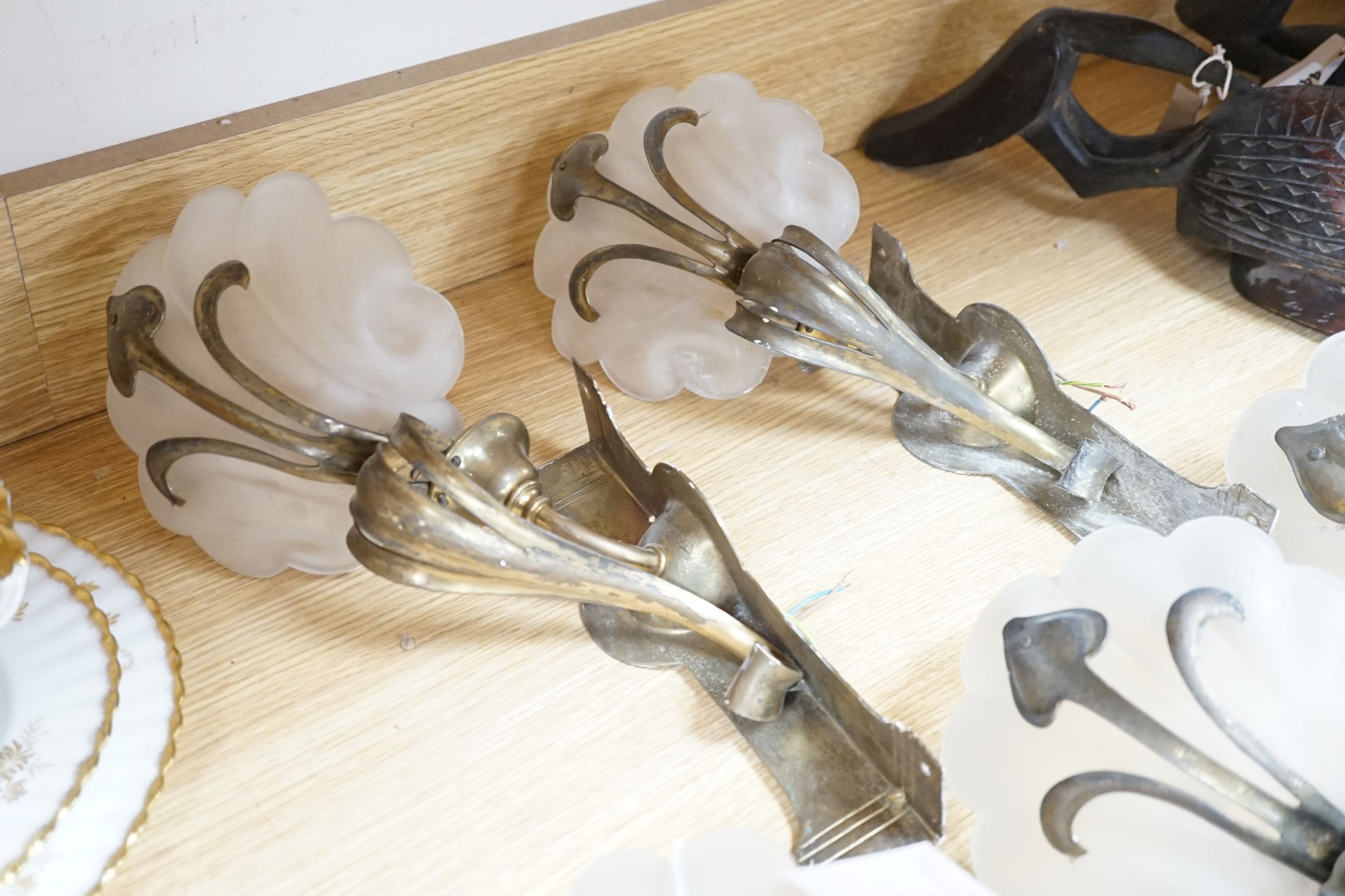 A set of five Art Nouveau style brass corner wall lights with frosted glass shades, 40 cm high